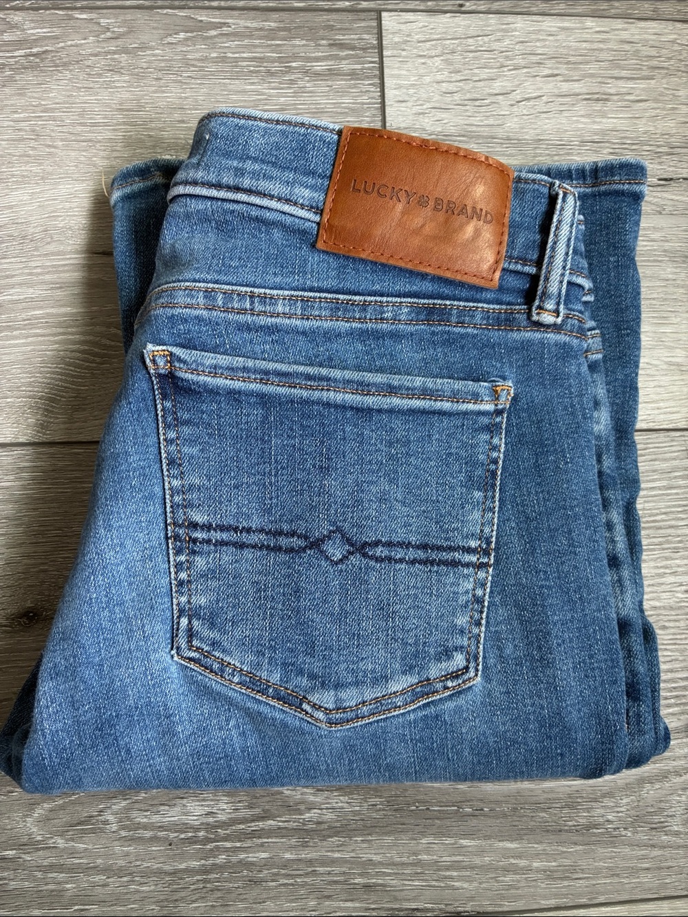 Lucky Brand Medium Blue Flare Jeans with Daisy Patch